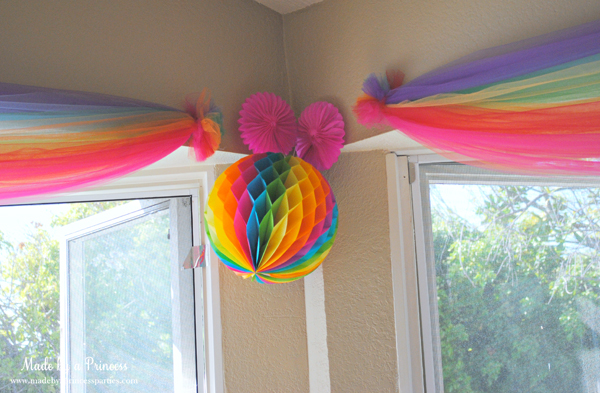 https://www.madebyaprincessparties.com/wp-content/uploads/2012/10/make-rainbows-out-of-tulle-and-hang-above-your-window.jpg