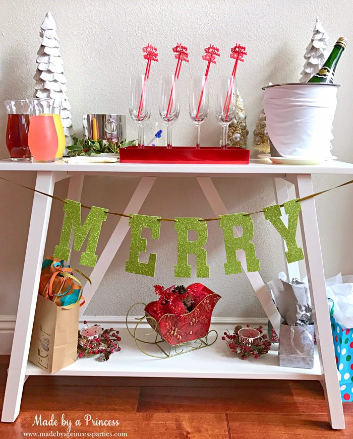 https://www.madebyaprincessparties.com/wp-content/uploads/2016/12/budget-friendly-holiday-mimosa-bar-party-drink-table-with-champagne-flutes-and-glitter-banner.jpg